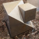 "Cube coming out of the Cube" sculpture